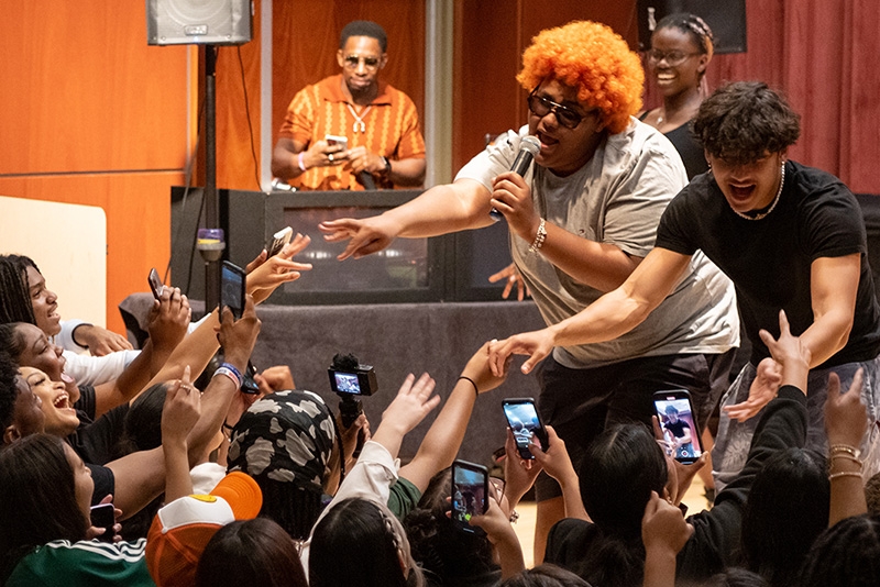 Union students on a stage singing.