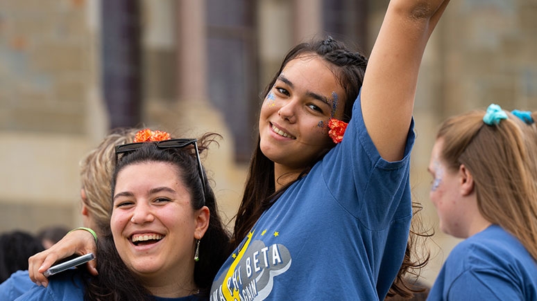 Two sorority sisters participating in all the pledge week excitement.