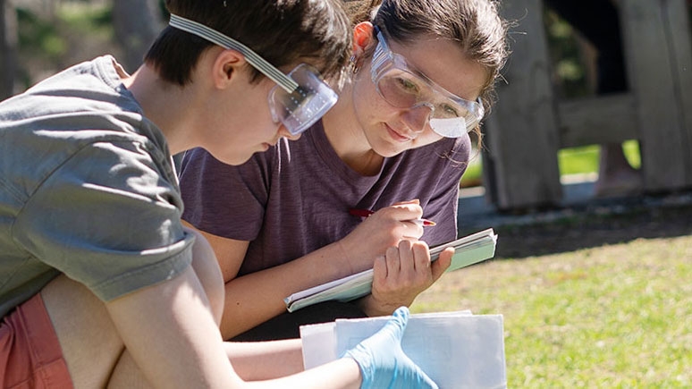 Students testing the soil as part of a research project