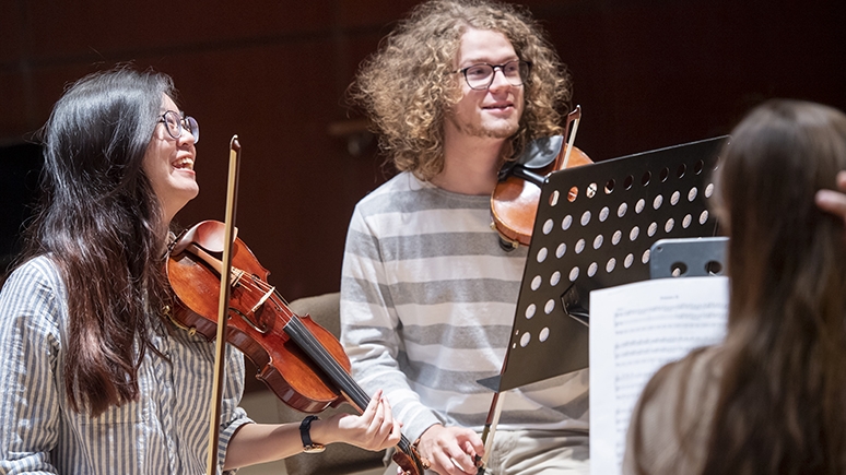 Students practicing instruments in the Taylor Music Center
