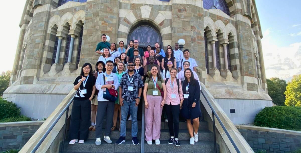 Visiting counselors taking a group photo on the steps of the Nott Memorial.